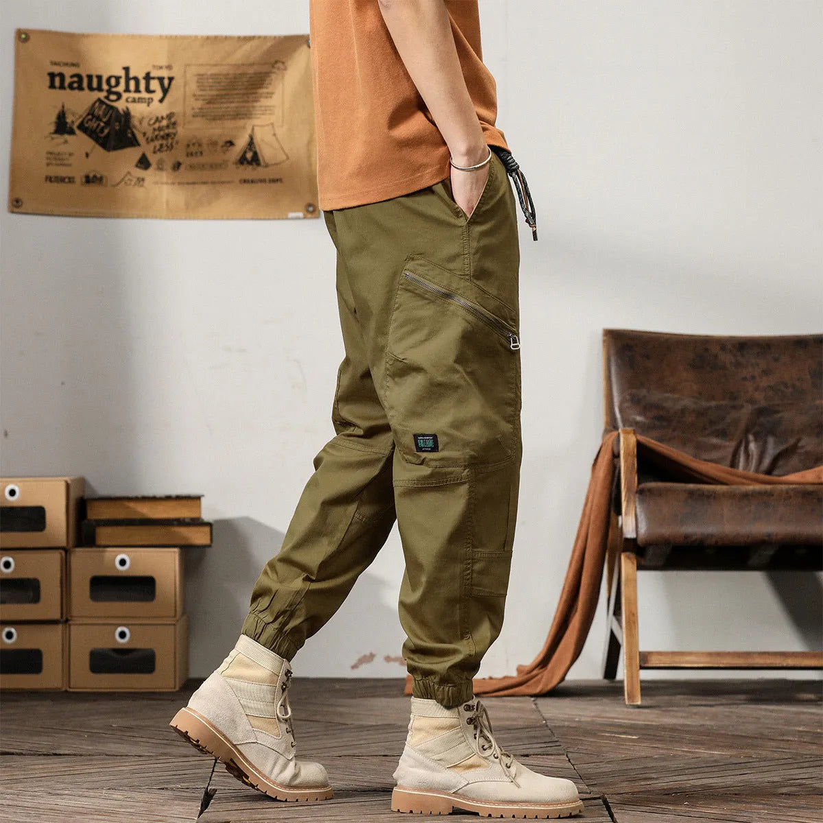 Men's tapered harem pants in cotton fabric showing ankle banded design and small leg opening