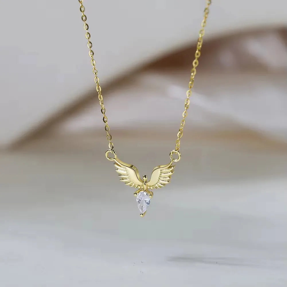 Sterling silver eagle pendant necklace with an O-ring chain on a model, showing white gold colour finish.