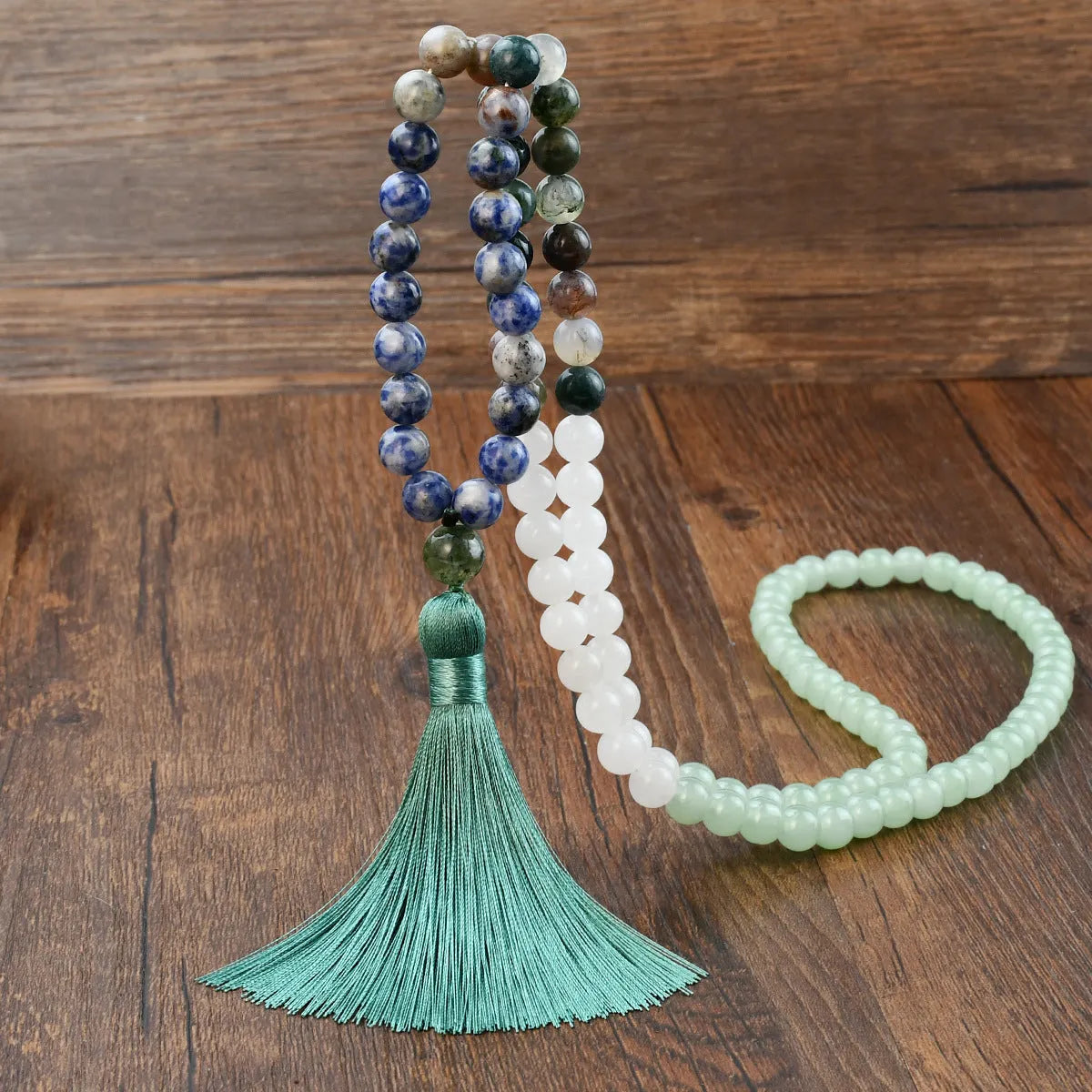 Handmade long beaded necklace with gemstone pendant and tassel, showing 81cm+ length.