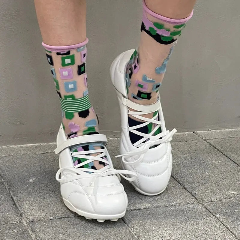 Women's silver lace-up bow sports shoes with round toe and mid-heel on a white background.