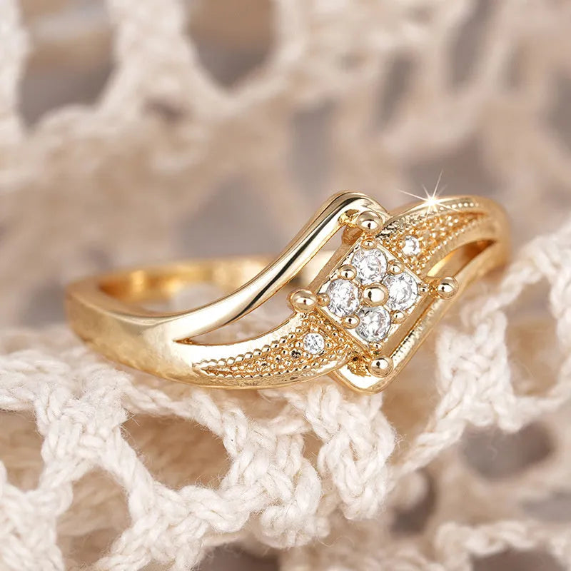 Yellow gold diamond shape copper ring with micro inlaid zircon geometric ornamentation showing line and quadrangle patterns