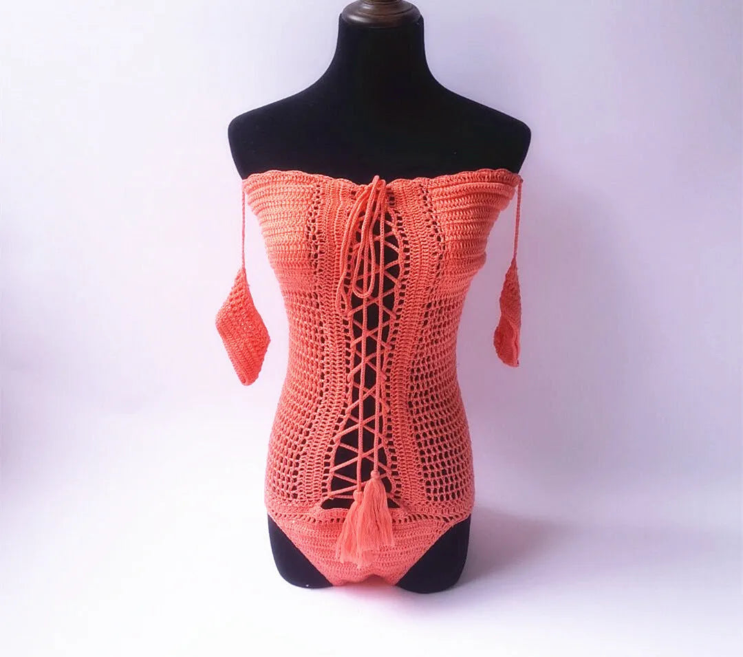 A woman's off-shoulder one-piece swimsuit on a hanger, shown in a choice of five colours.