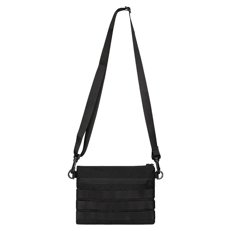 Black Oxford cloth military kit bag showing compact 18cm by 3.5cm size.