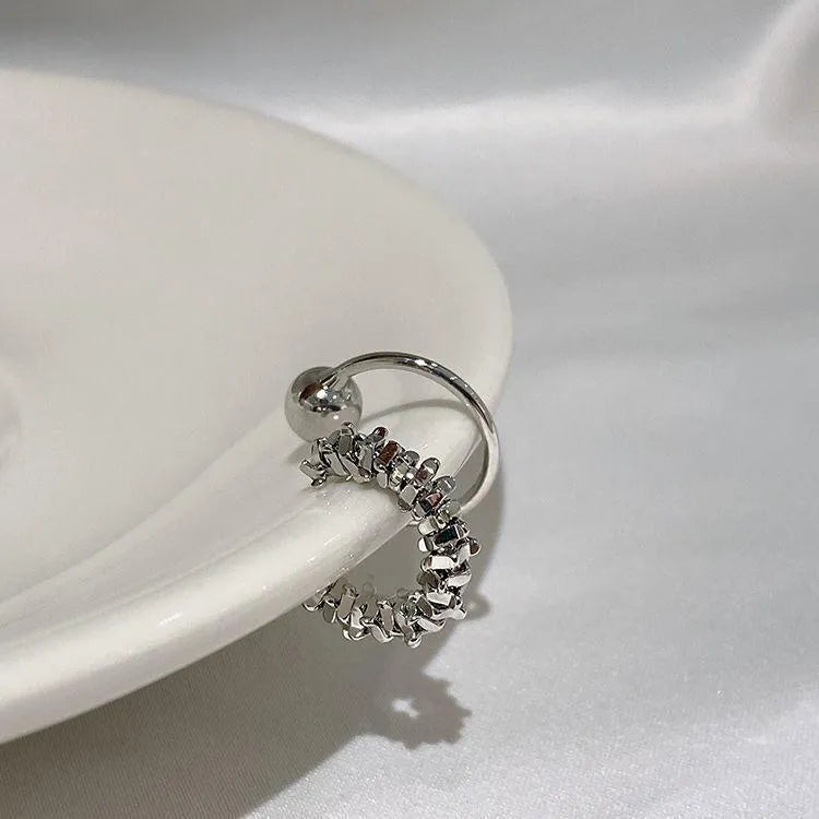 Women's clip-on earrings with irregular geometric shape and frosty finish in alloy