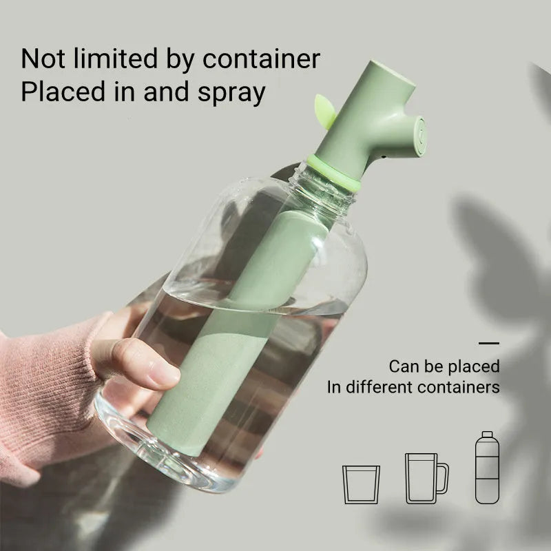Transparent plastic portable USB humidifier on a desk with mist output
