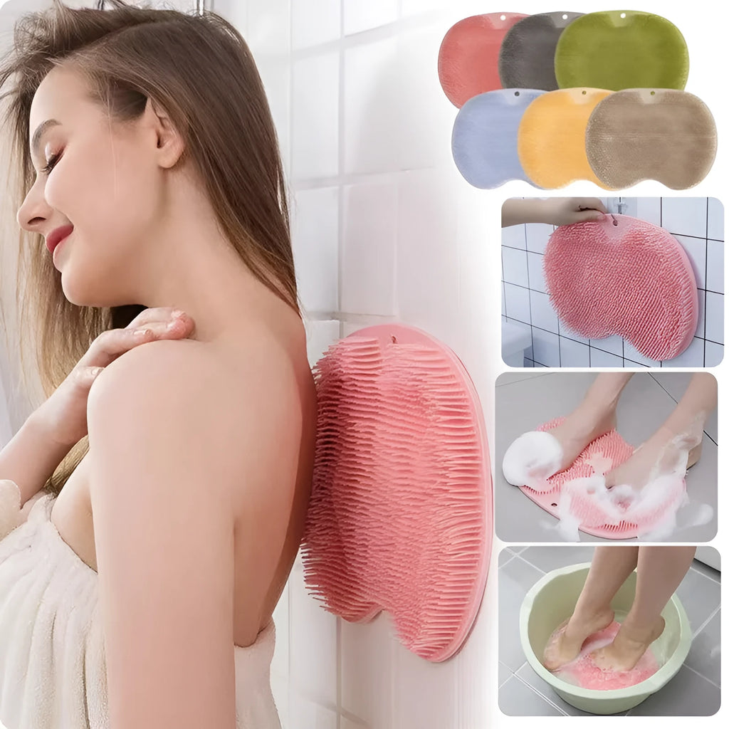 Orange silicone bath brush with suction cups on back and hundreds of small bristles for cleaning feet and back.