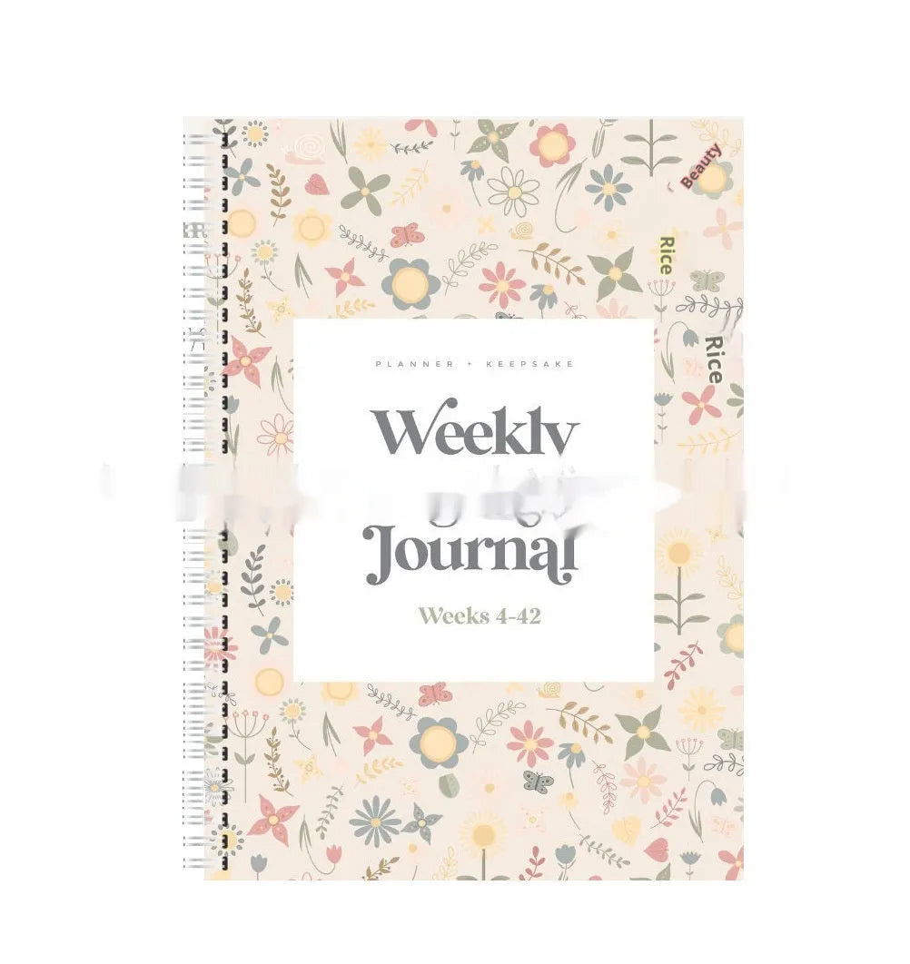 A5 pregnancy weekly diary notebook open showing weekly formatting pages