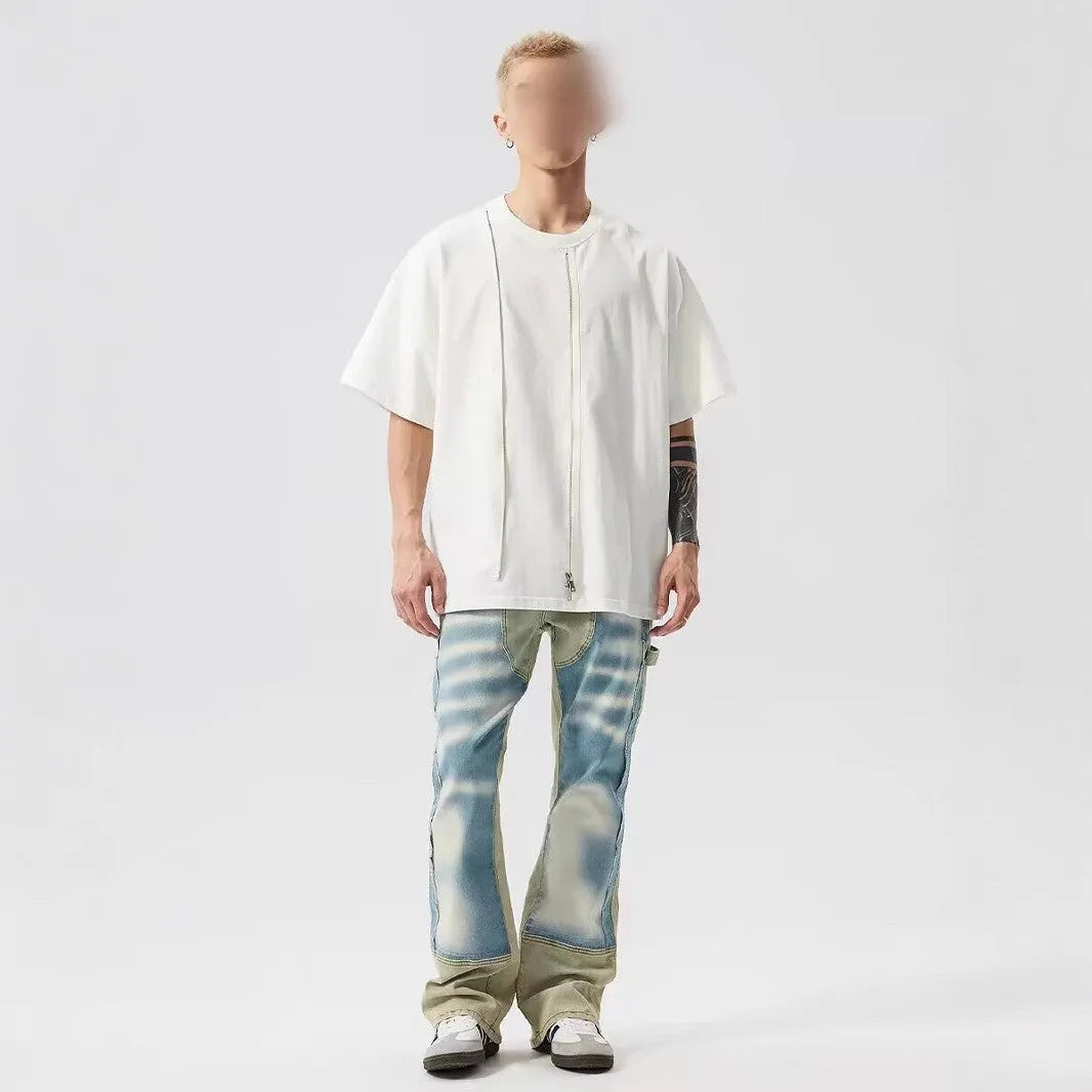 Yellow and blue retro jeans with patchwork and splash-ink damaged design, mid-waist cut.