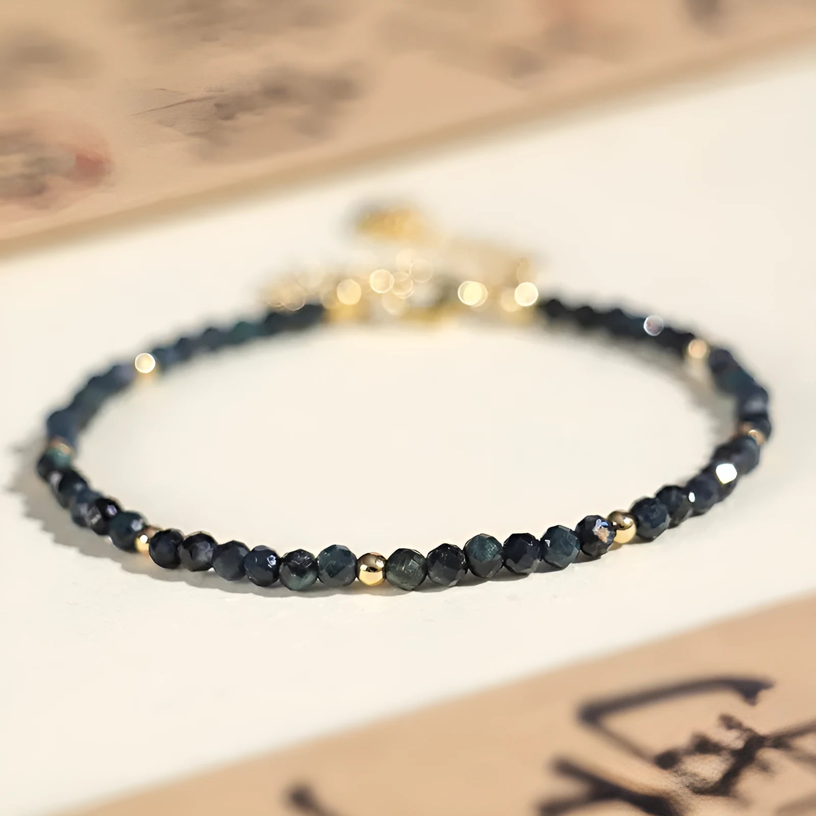3mm blue tourmaline spacer bead bracelet showing alternating gemstone beads and metal elements