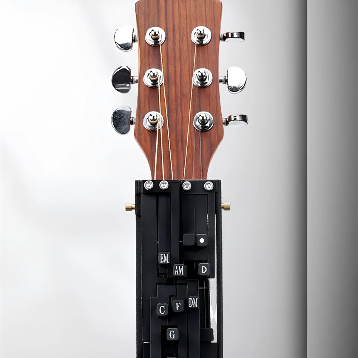 Black guitar chord maker device for auxiliary folk guitar playing and singing practice