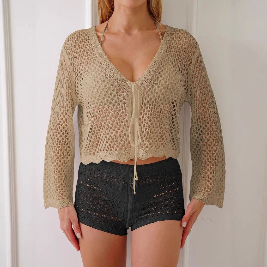 Women's apricot hollow woven cardigan blouse with bell sleeves laid flat showing 40cm length