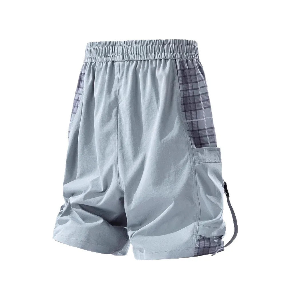 Men's loose fit cargo shorts with plaid stitching detail in black, light grey, and smoky grey.