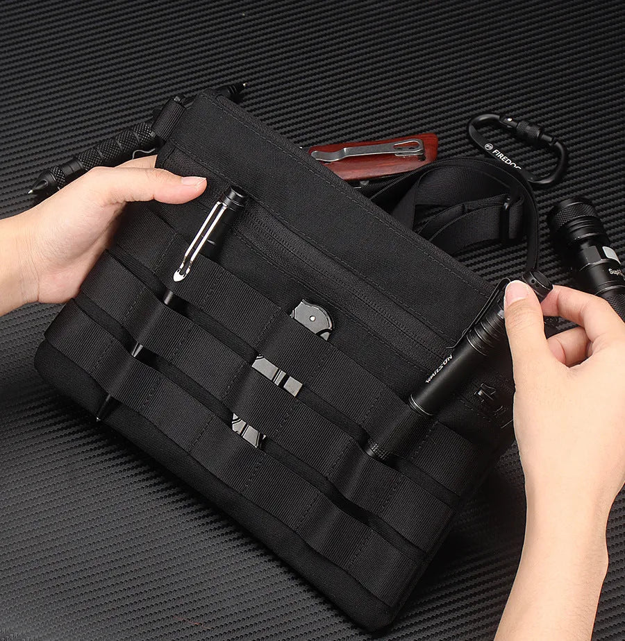 Black Oxford cloth military kit bag showing compact 18cm by 3.5cm size.