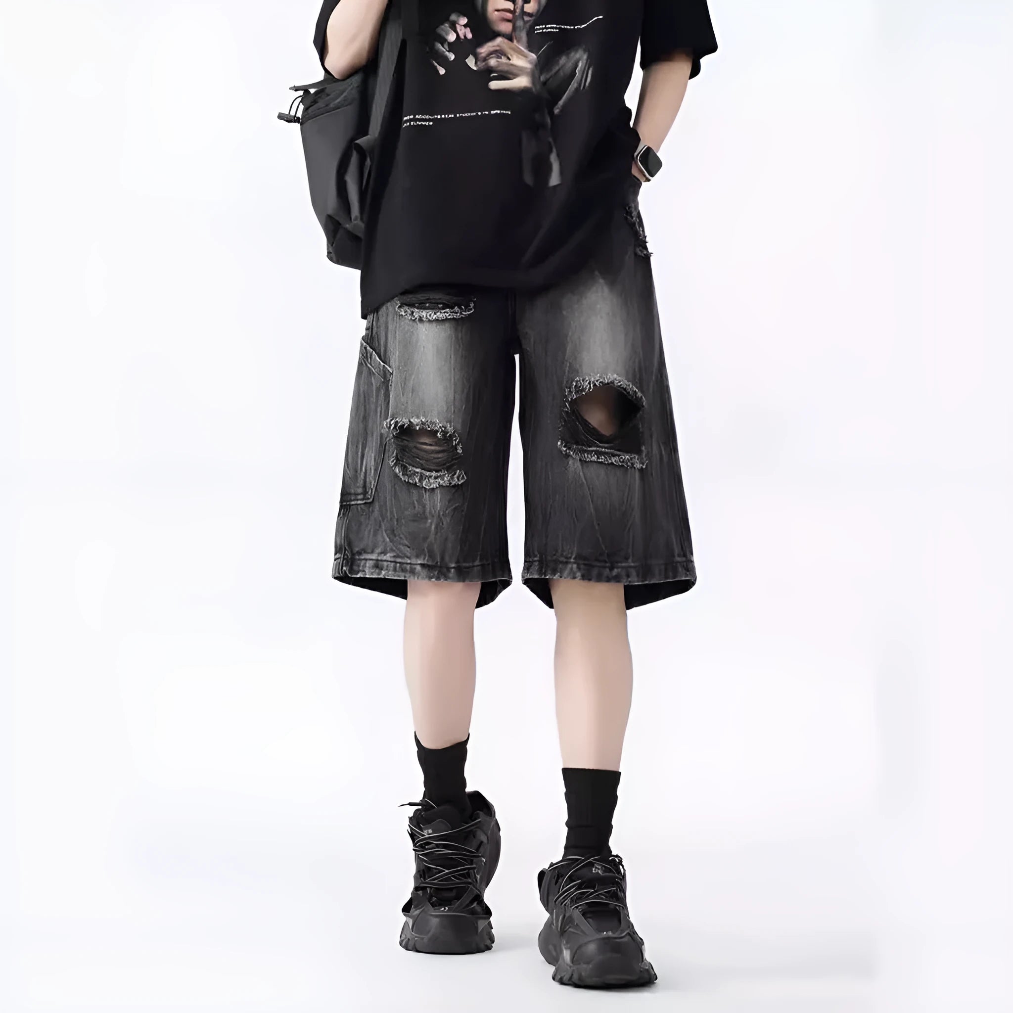 Washed blue denim shorts with ripped detailing on a hanger, showing loose retro fit