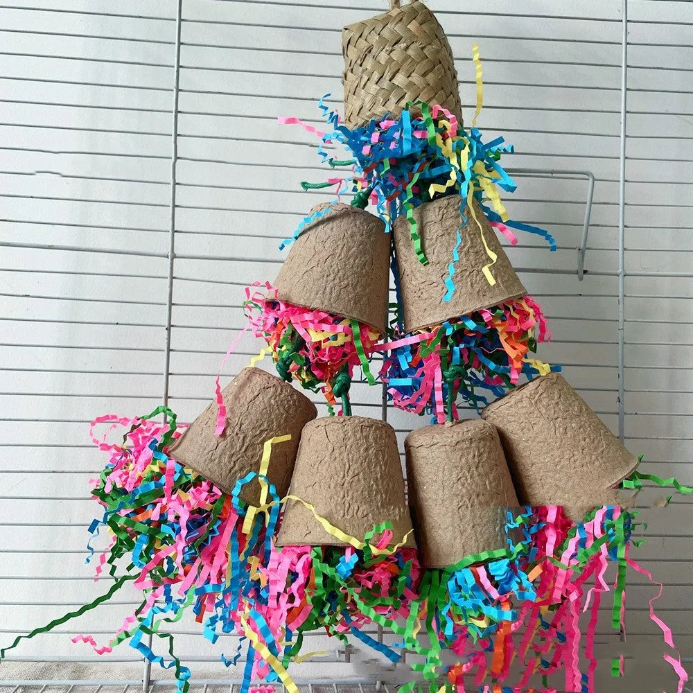 Natural wood-coloured palm weaving parrot gnawing toy in a paper cup shape, hanging.