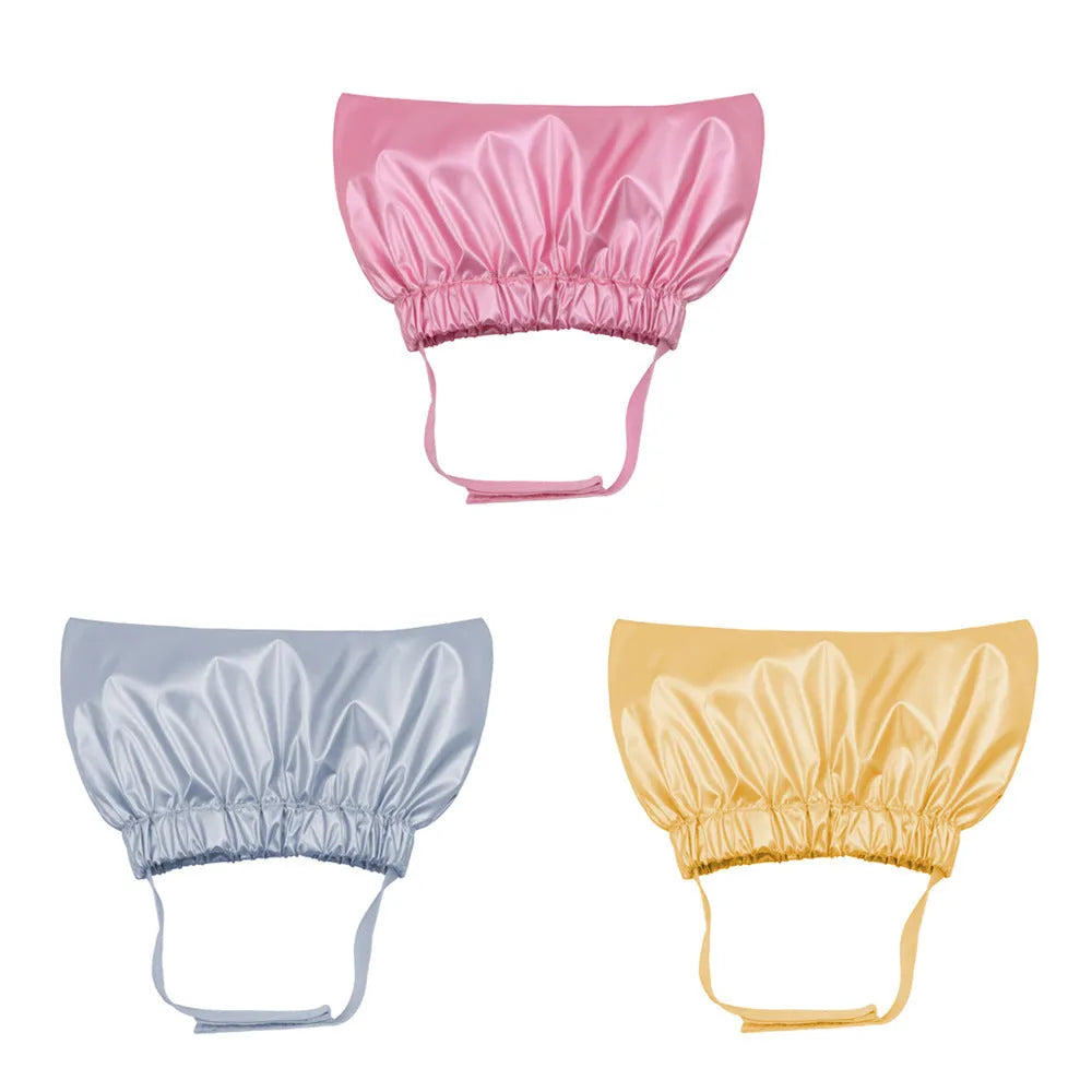 Silver pink gold waterproof adjustable shower cap for dogs and cats on a non-woven fabric.