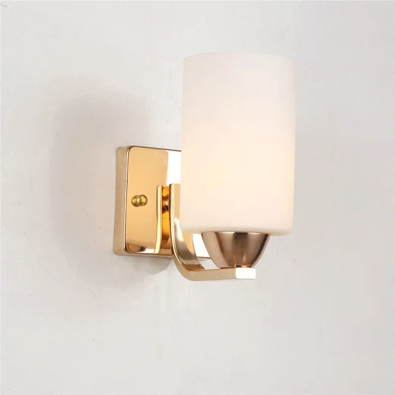 Chrome-finished glass wall lamp with minimalist design mounted on wall