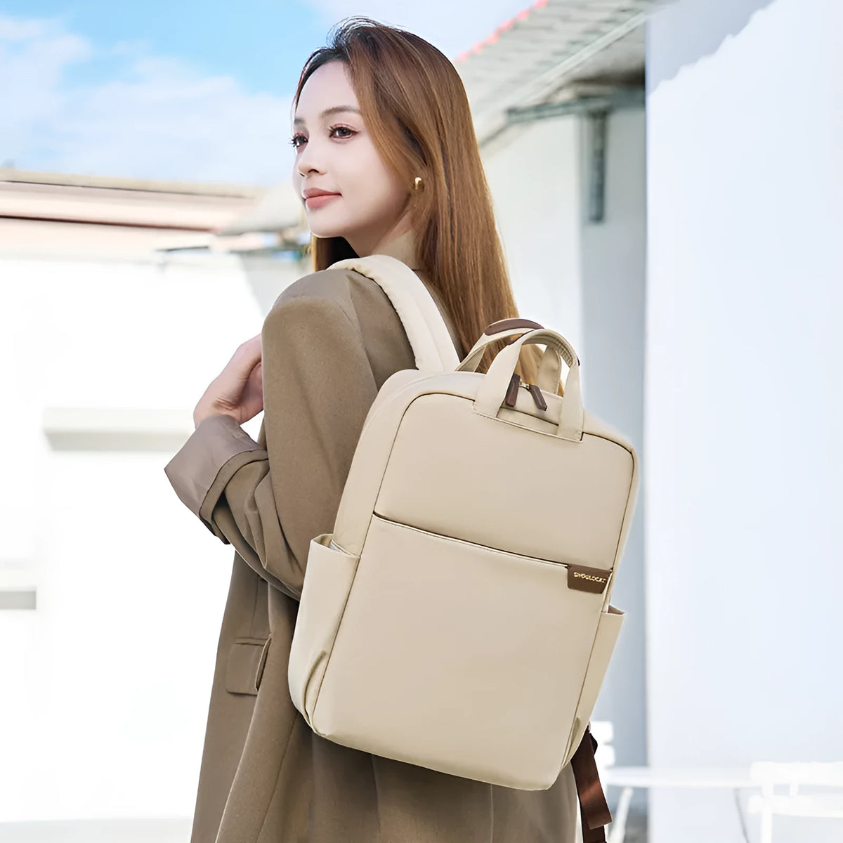 Large women's travel backpack with multiple compartments in apricot colour
