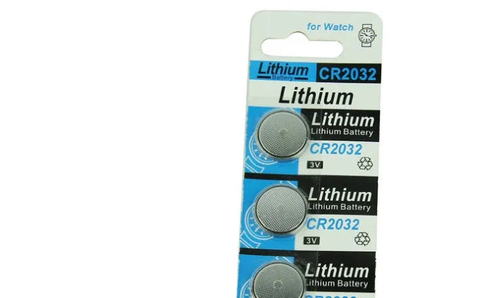 CR2032 3V lithium button battery on a card, showing its 20mm diameter and steel case.