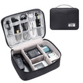 Black waterproof cable organizer bag open, showing removable dividers and mesh pockets for electronics.
