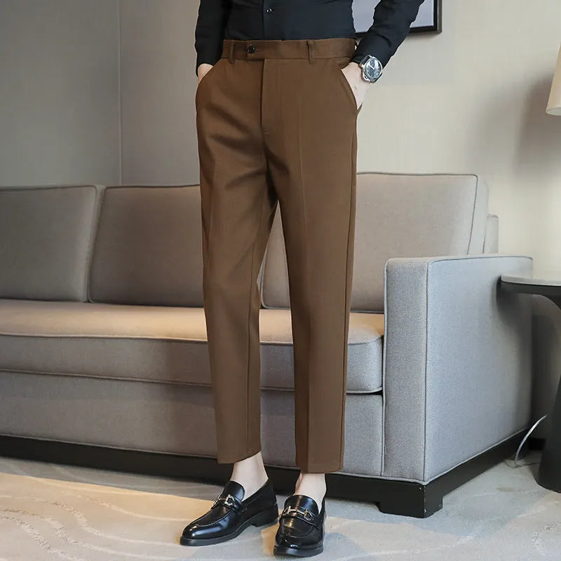 Straight cut brown corduroy trousers with elastic waistband shown front and back views