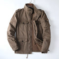 Men's loose fit cotton twill jacket in light army green with zip front, shown on a model.