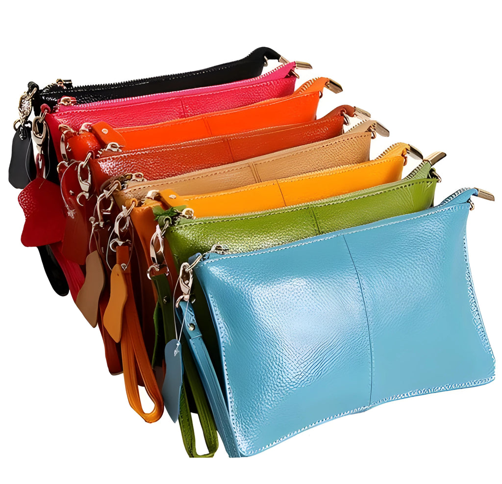 Lady's cowhide slant bag with hand strap and long shoulder strap shown in multiple colours.