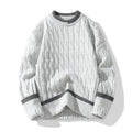 Two loose fit men's long sleeve pullover sweaters folded, shown in light blue and grey colour options.