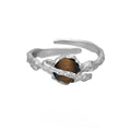 Women's Saturn open ring with adjustable size and electroplated white gold finish