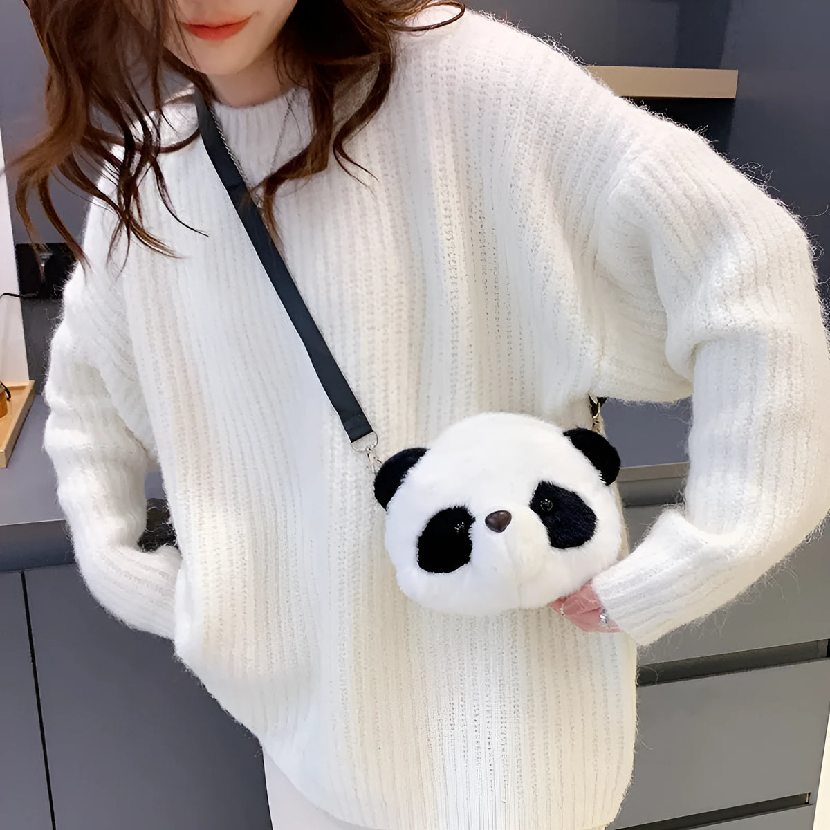 Plush cylindrical crossbody bag with panda head design measuring 18cm by 15cm by 8cm