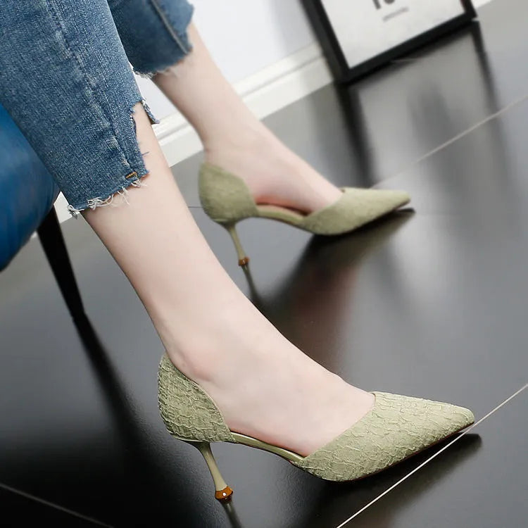 Women's black pointed-toe stiletto high heels with PU leather upper and thin heel.