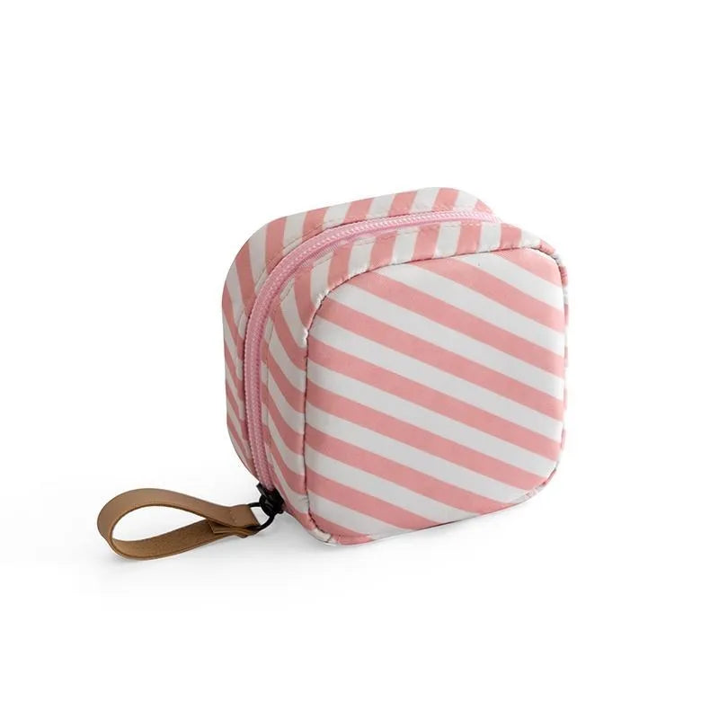Blue cloth cube makeup storage bag showing cubic shape and plain-patterned material