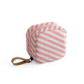 Blue cloth cube makeup storage bag showing cubic shape and plain-patterned material