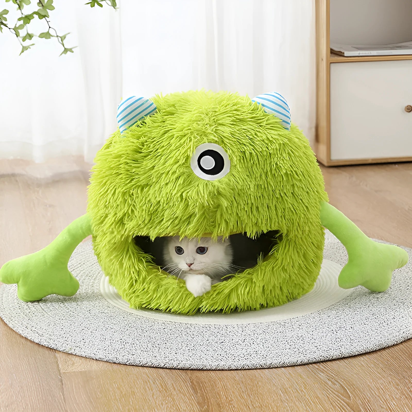 Fluffy round pet bed for cats and small dogs on a wooden floor