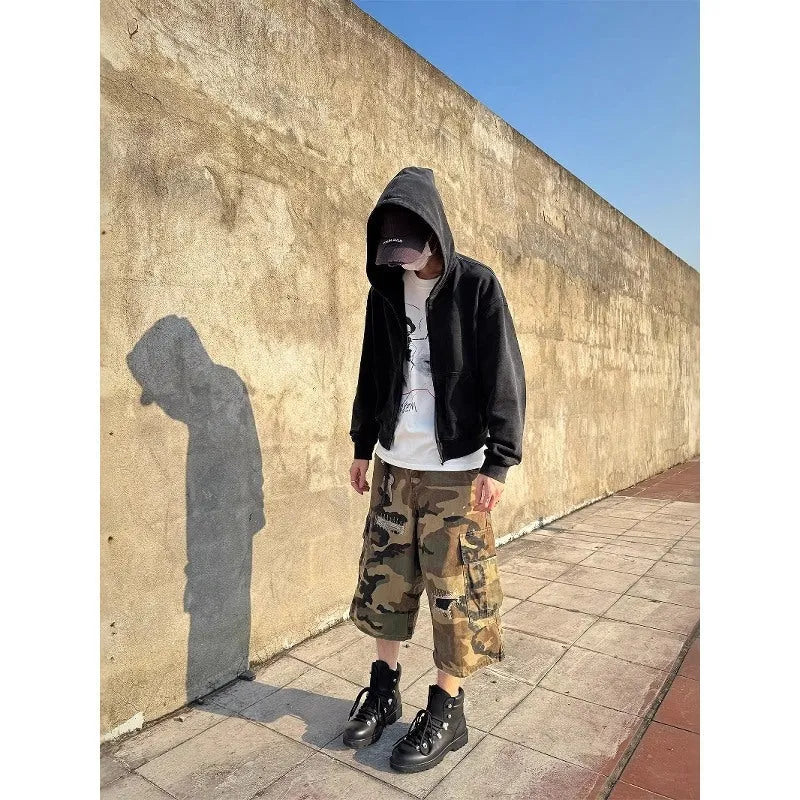 Men's camouflage cropped jeans with patchwork and ripped detailing in straight-leg loose fit
