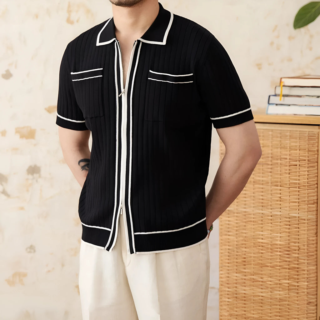 Slim-fitting black short-sleeved polo shirt with a lapel collar, made from a knitted viscose and polyester fabric blend.