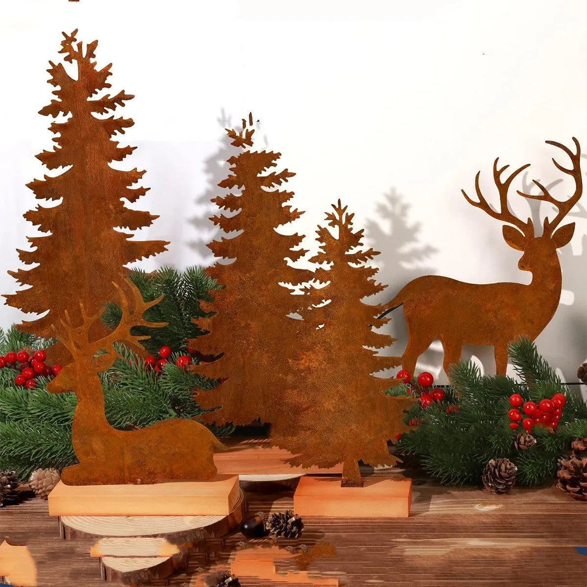 Three metal Christmas tree ornaments with elk silhouettes in rusty iron finish