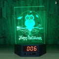 Blue dolphin 3D LED night light on table showing wireless charging pad and remote control.
