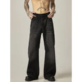 Black loose-fit straight-leg retro jeans with a zipper fly on a mannequin.