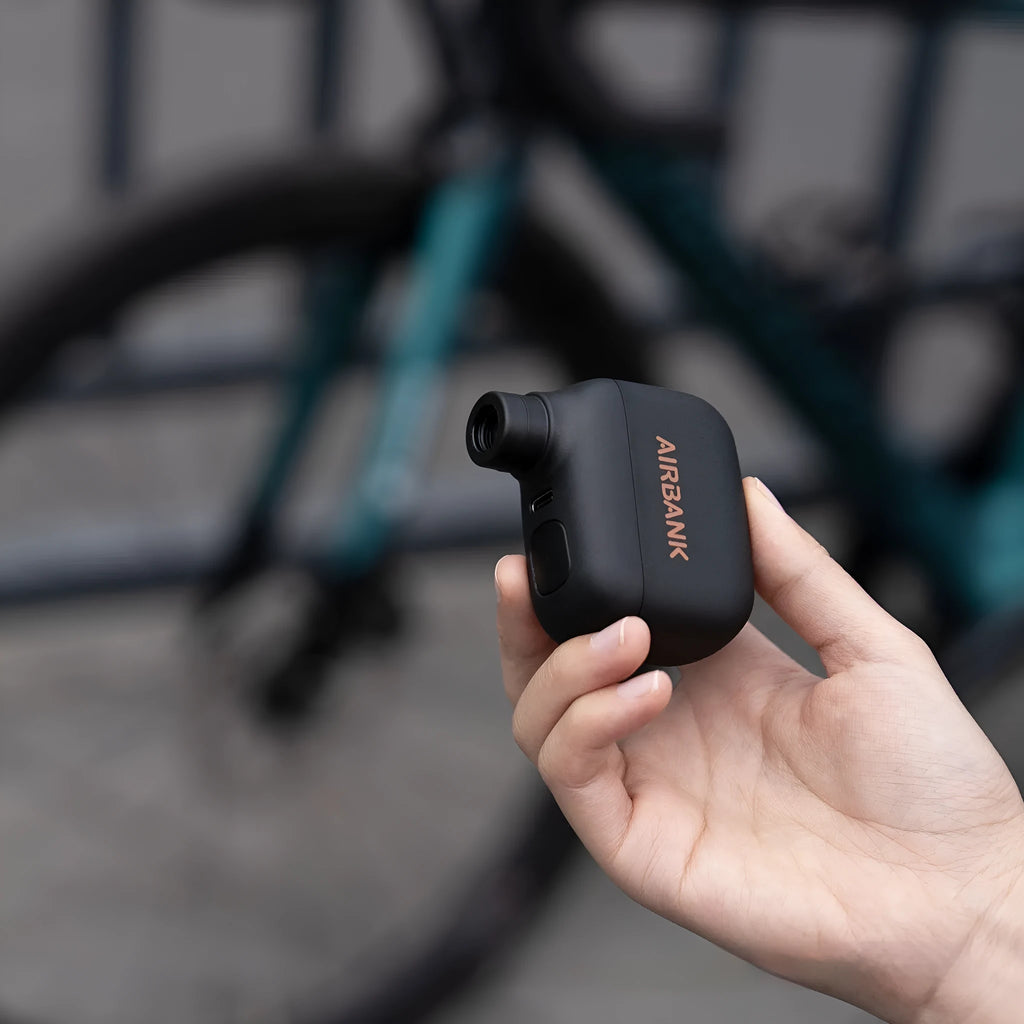 AS100 black plastic electric inflator pump for bicycles with USB charging cable and waterproof bag