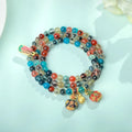 Women's agate snake bracelet with copper coin detailing and coloured glaze accents in geometric design