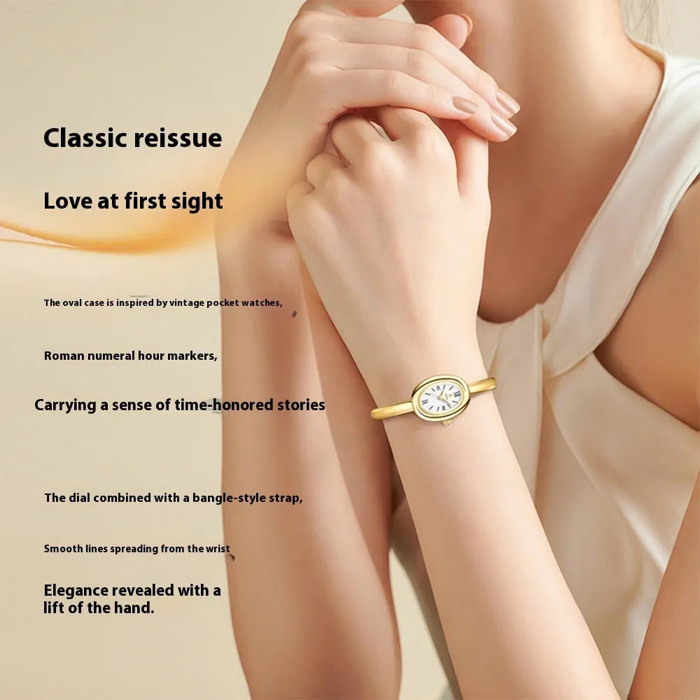 Women's oval retro quartz watch in gold colour with spiral pattern dial, showing 8mm thickness