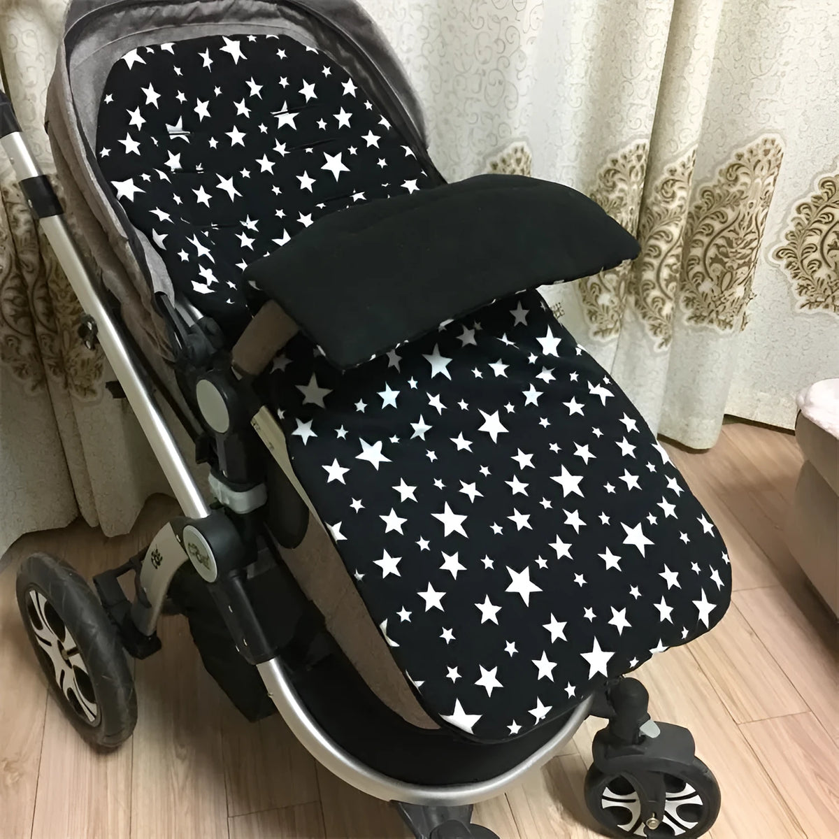 Envelope-style baby stroller sleeping bag in beige colour showing thick cotton wool filling and soft lining.