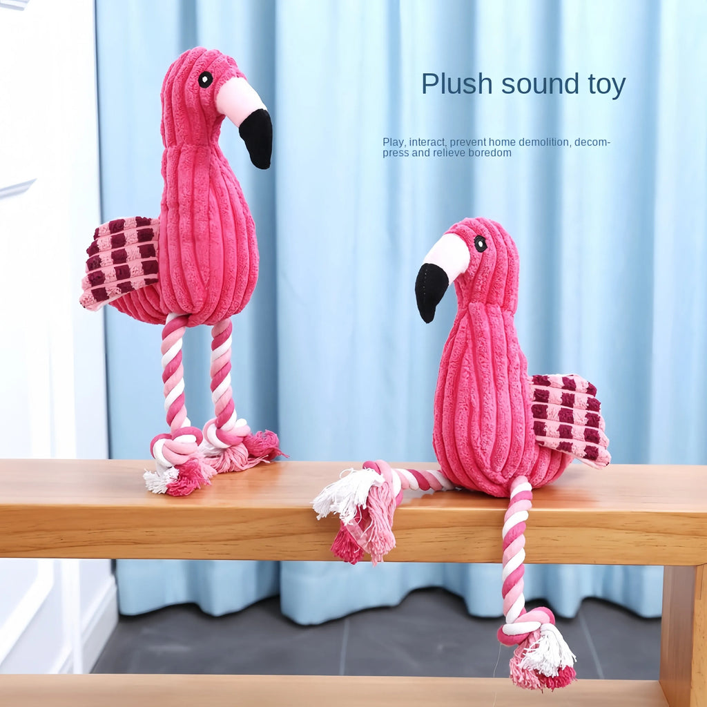 Pink animal-shaped corduroy plush dog toy with squeaker on a white background