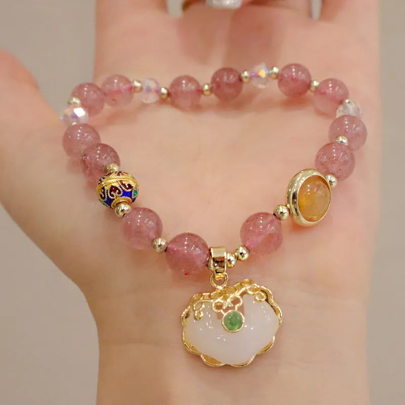 Women's ethnic bracelet with geometric metal decorations and strawberry quartz or gray jade beads