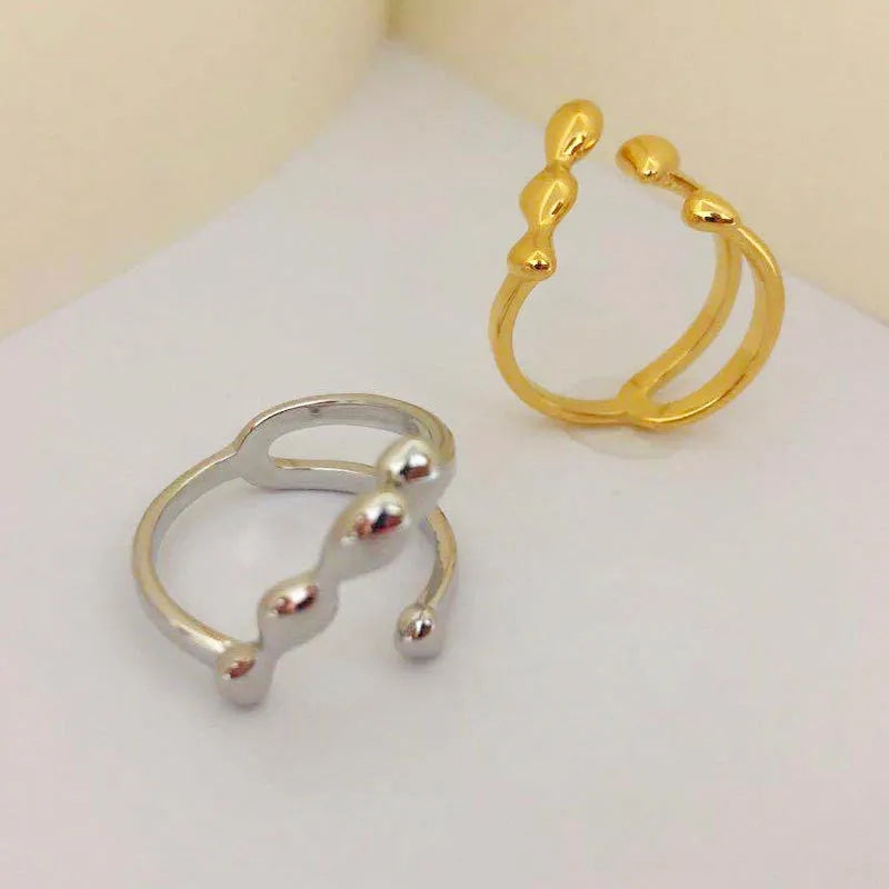 Brass opening ring with sphere circle detail in gold colour, adjustable women's fashion jewellery