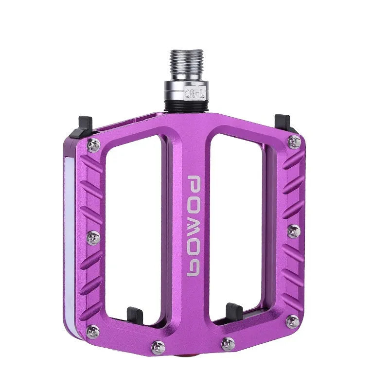 Bicycle pedal with integrated LED lights in aluminium alloy construction showing colour options