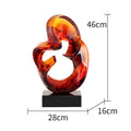 Transparent blue and orange red resin craft ornament sculpture with modern glass-like finish