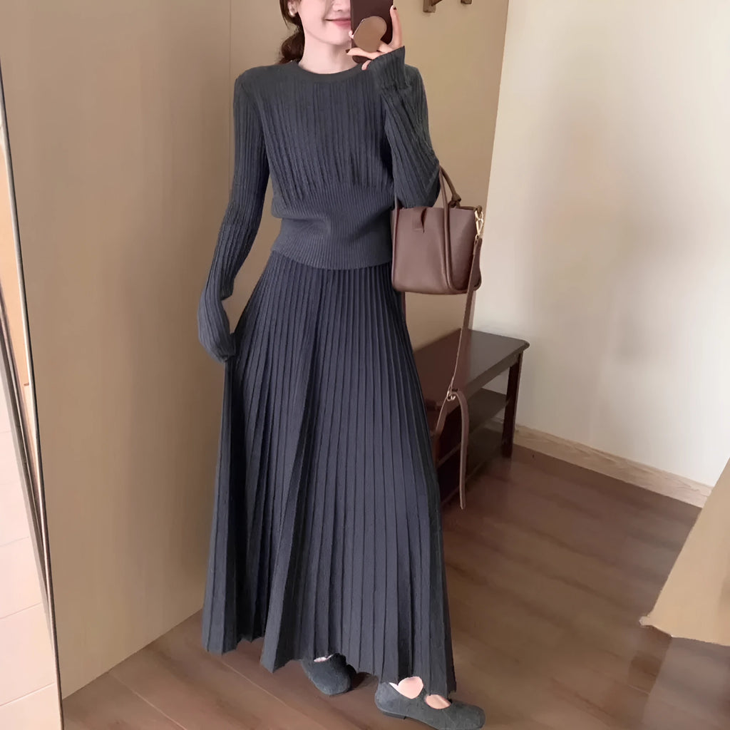 Dark grey knitted dress and skirt suit with a 3D pattern and ethnic collage stitching.
