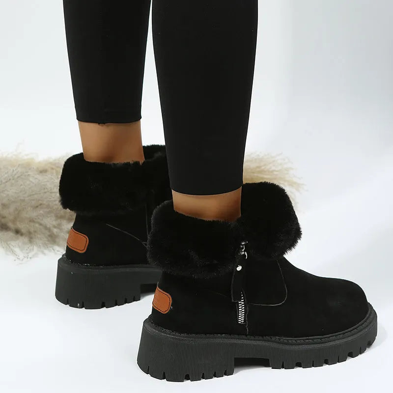 Women's black high-top snow boots with faux suede uppers, side zipper, and fluffy fur lining.